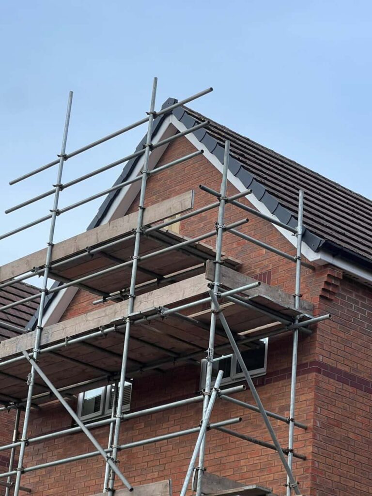 This is a photo of a roof which has just been repaired. There is a scaffold located at the gable end for access onto the roof. Works carried out by LS Roofing Chinnor